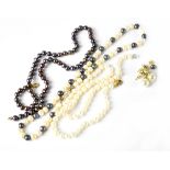 Three cultured pearl necklaces to include white and blue and iridescent colours,