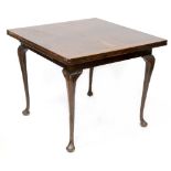 An early 20th century reproduction draw-leaf dining table with square top, on cabriole legs,