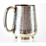 A Victorian hallmarked silver children's mug decorated with a wide band of fern around a central