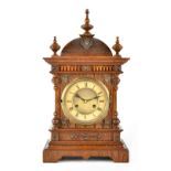 A late 19th/early 20th century German oak-cased mantel clock,