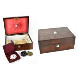 A Victorian rosewood stationery box with mother of pearl inlaid and shield-shaped cartouche to the