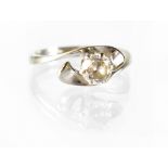 A modern white metal diamond solitaire ring, the claw-set brilliant diamond approx 0.