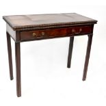 A 19th century mahogany fold-over side table, one long frieze drawer to column supports,