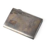A George V hallmarked silver cigarette case of rectangular form with engine turned Art Deco