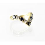 An 18ct gold diamond and sapphire wishbone ring,