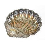 An Edwardian hallmarked silver shell-shaped bowl, fluted with pierced and repoussé decoration,