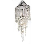 A cut glass waterfall chandelier on brass mounts, with clear glass drops, height approx 45cm.