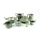 A quantity of late 19th/early 20th century mainly pewter ware to include a beaten teapot,