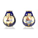 A pair of Royal Crown Derby miniature vases hand painted with sailing boats by W Dean, signed,