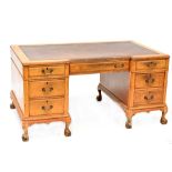 An early/mid-20th century seven-drawer pedestal desk,