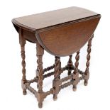 A reproduction small oak gateleg side table on twist legs, width 67cm.