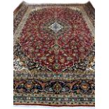 A wool hand knotted Persian carpet from the city of Kashan, Classical floral medallion design,