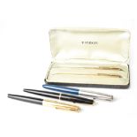 A collection of Parker pens to include a gold plated pen and mechanical pencil set in Parker