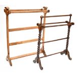 A 19th century style wooden towel rail with twist supports on outswept legs,