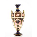 A Royal Crown Derby Imari twin-handled vase of hexagonal form, numbered 1128 1548,