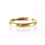 A 9ct gold wedding band, stamped 375, maker H&M, Birmingham 1950, size S1/2, approx 2.9g.