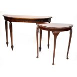 An early/mid-20th century mahogany demi-lune hall table with floral and acanthus leaf decoration to