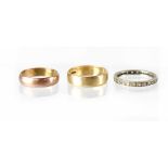 Two vintage 9ct gold band rings, the lighter coloured ring is size Q, the other is size P,