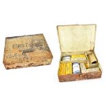 A vintage first aid kit with various dressings, etc,