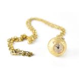 Lanco; a yellow metal manual wind ball-form watch and chain, 18mm.