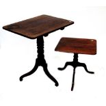 A 19th century oak rectangular tilt-top table on turned pedestal base to tripartite support,