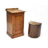 An early 20th century ash pot cupboard with fielded panel door raised on plinth base,