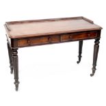 A 19th century mahogany two-drawer writing table to tapering turned supports and castors,