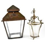 An early 20th century brass outdoor light shade, a brass frame and canopy holding four glass panels,