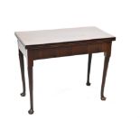 A 20th century mahogany fold-over tea table, to tapering supports and pad feet,