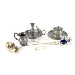 A Mappin & Webb three-piece cruet set, a silver plated ladle with engraved crest,