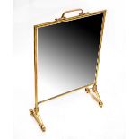 A 19th century style brass-framed fire screen inset with a rectangular bevelled and star decorated