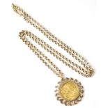 A George V 1914 sovereign in gold open link circular mount on a yellow metal belcher chain (length