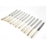 A partial set of eleven Victorian silver-handled dessert knives, reeded handles with engraved crest,
