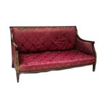 A 19th century mahogany-framed settee in the manner of Thomas Hope,