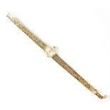 Omega; a 9ct yellow gold ladies' cocktail watch, the dial set with baton numerals,