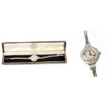 A 9ct white gold cocktail watch, the circular silvered dial set with baton numerals,