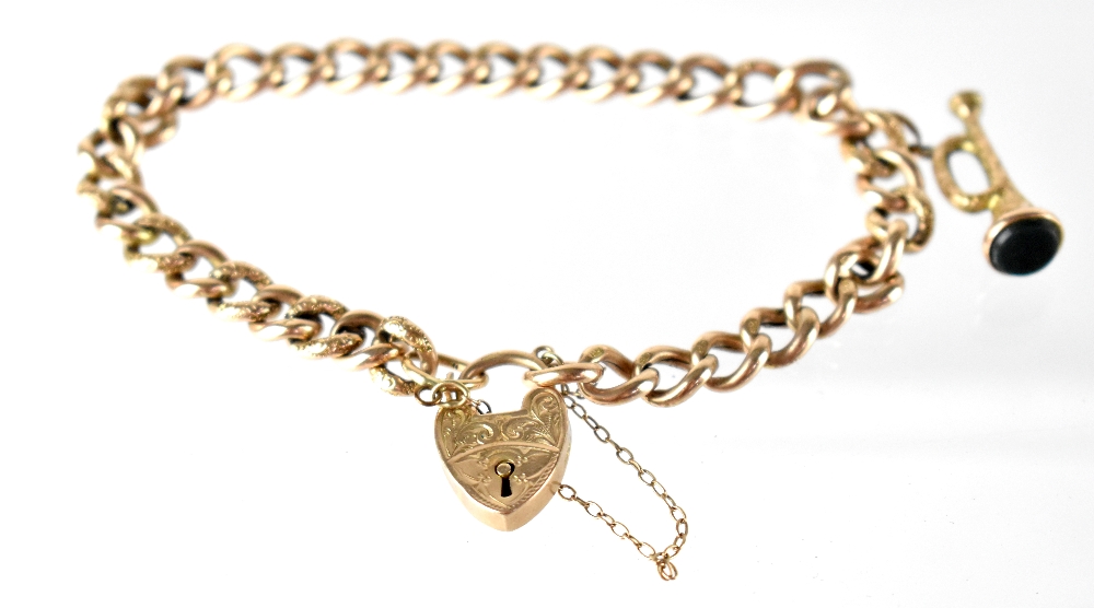 A 9ct gold bracelet, the half textured belcher chain with a trumpet charm,