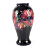 A Moorcroft 'Anemone' pattern vase of baluster form, blue ground, green impressed mark,