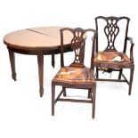An early 20th century mahogany extending dining table with two extra leaves,