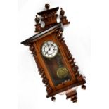 An early 20th century mahogany-cased Vienna-style wall clock,