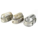 Eight Lacent industrial wall lights, cast metal fittings with domed hinged glass covers,
