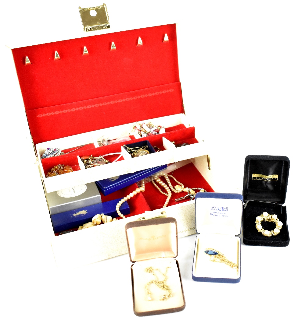 A jewellery box containing a small quantity of earrings, necklaces, brooches, faux pearls, etc.