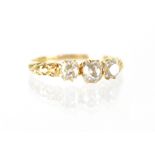 An 18ct yellow gold diamond trilogy ring, size P, approx 2.6g.
