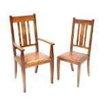 A late 19th century oak carver dining chair with slat back and three matching chairs (4).