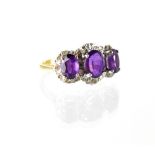 An 18ct gold amethyst and diamond ring,