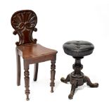 A Victorian mahogany hall chair with shaped back,