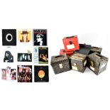 Seven record carrying cases containing a large quantity of vinyl singles to include Sting,