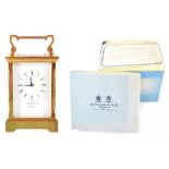 A Garrard & Co boxed brass carriage clock, the white enamelled dial set with Roman numerals,