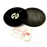 A limited edition Public Image Limited (PIL) vinyl box set in circular metal tin,