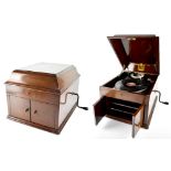 An early 20th century 'His Master's Voice' wind-up gramophone with two small doors to the front,